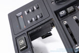 Picture of a black climate control panel and clock for a BMW E30 3-Series