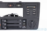 Picture of a black climate control panel and clock for a BMW E30 3-Series