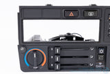 Picture of a black climate control panel and clock for a BMW E30 3-Series