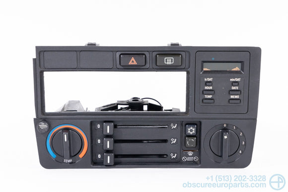 Picture of a black climate control panel and clock for a BMW E30 3-Series
